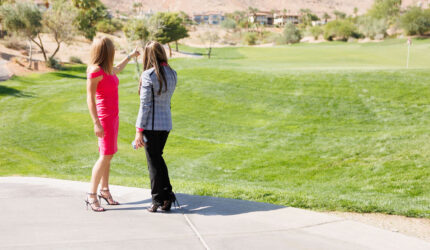 Carla and Gisella on a golf cart path.