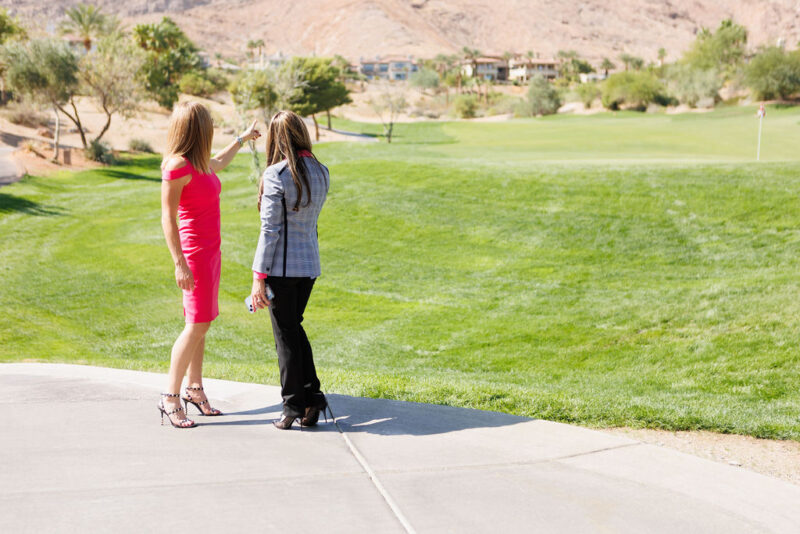 Carla and Gisella on a golf cart path.